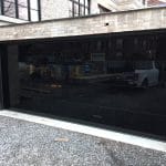 Modern Black Glass Garage Doors with smooth finish