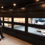 Smooth finish Modern Black Glass Garage Doors installed in Toronto