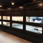 Smooth Black Glass Garage Doors fitted in Toronto house