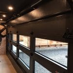 Smooth Black Glass Garage Doors fitted in Toronto house by Smart Doors