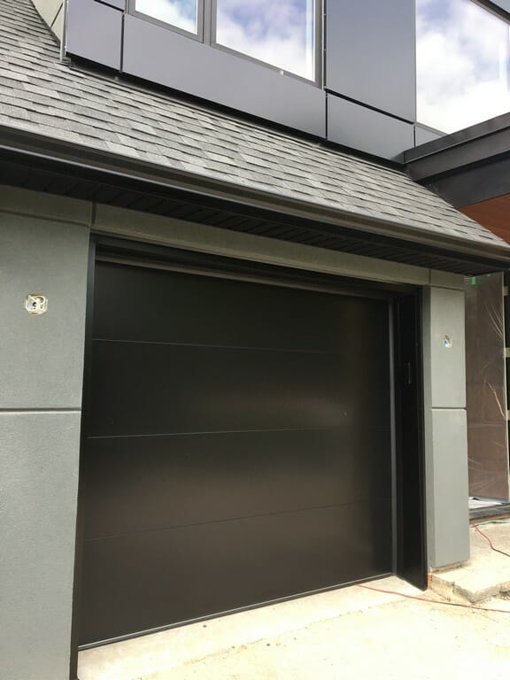 Smooth Black Glass Garage Doors Installation In Toronto by Toronto's #1 Overhead Garage Doors Replacement Company