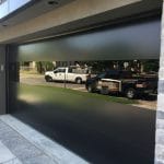 Black glass Modern garage door installed in Toronto