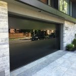 Black glass Modern garage door installed in Toronto home