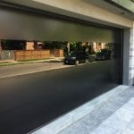 Black glass Modern garage door installed in Toronto home by smart doors