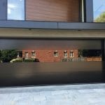 Smooth Black Glass Garage Doors Installation In Toronto