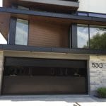 Toronto Installation of smooth black glass garage door by Smart Doors