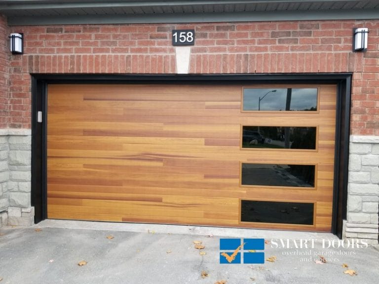 Overhead Garage Doors Installations in Toronto featuring cedar wood overlay door with windows